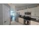 Open kitchen design with stainless steel appliances and access to the living area at 2530 Tamarind Dr, Edgewater, FL 32141