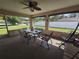 Relaxing patio with ceiling fan and view of the yard at 2530 Tamarind Dr, Edgewater, FL 32141