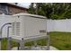 Whole house Generac generator on a concrete pad, with a fenced yard in the background at 2797 Nordman Ave, New Smyrna Beach, FL 32168