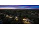 This aerial view highlights the neighborhood at dusk, with the red roof standing out at 2813 Ballard Ave, Orlando, FL 32833