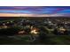 Panoramic aerial view showcasing the property's location within a neighborhood, featuring lush greenery and evening sky at 2813 Ballard Ave, Orlando, FL 32833