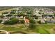 Expansive aerial view of a residential community with lush greenery and a well-maintained golf course at 2813 Ballard Ave, Orlando, FL 32833