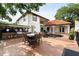 Expansive backyard with an outdoor kitchen, dining area, pool, and fireplace, ideal for entertaining and enjoying the outdoors at 2813 Ballard Ave, Orlando, FL 32833