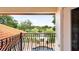Scenic view from balcony overlooking a well-manicured golf course and a sparkling pool at 2813 Ballard Ave, Orlando, FL 32833
