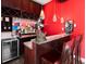 Custom bar with shelving, stone countertop, and seating at 2813 Ballard Ave, Orlando, FL 32833