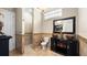 Bathroom with tiled floors, a black vanity with dual sinks, and a walk-in shower at 2813 Ballard Ave, Orlando, FL 32833