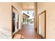 Covered outdoor hallway with views of the pool and backyard, plus glass doors and a white door at 2813 Ballard Ave, Orlando, FL 32833