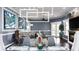 Living room showcasing a modern light fixture, elegant decor, and fireplace with an open floor plan at 2813 Ballard Ave, Orlando, FL 32833
