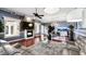 Modern living room with hardwood floors, stylish furniture, a fireplace, and open access to the dining area at 2813 Ballard Ave, Orlando, FL 32833