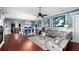 Inviting living space with an open floor plan, hardwood floors, modern lighting, and comfortable seating at 2813 Ballard Ave, Orlando, FL 32833