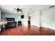 Spacious primary bedroom featuring cherry wood floors and a ceiling fan at 2813 Ballard Ave, Orlando, FL 32833