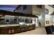 This outdoor kitchen boasts a built-in grill, counter space, sink, and tiled backsplash at 2813 Ballard Ave, Orlando, FL 32833