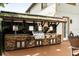 Outdoor kitchen with a built in grill, sink, countertops, storage, and tile backsplash, perfect for entertaining guests outdoors at 2813 Ballard Ave, Orlando, FL 32833