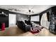 Theater room featuring comfortable seating, a projector screen, and sleek black accents at 2813 Ballard Ave, Orlando, FL 32833