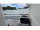 Backyard patio area with air conditioning unit and privacy fence at 2820 Tamarind Dr, Edgewater, FL 32141