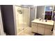Bathroom features a glass shower, vanity with sink, and neutral tones at 2820 Tamarind Dr, Edgewater, FL 32141