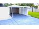 Detached carport structure features a painted foundation and a covered roof for parking at 2820 Tamarind Dr, Edgewater, FL 32141
