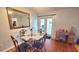 Dining area boasts a glass table, decorative chairs, and a glass paneled door for lots of light at 2820 Tamarind Dr, Edgewater, FL 32141