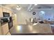 Bright kitchen featuring granite countertops, stainless steel appliances, and ample cabinet space at 2820 Tamarind Dr, Edgewater, FL 32141