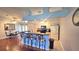 Bright kitchen featuring bar seating, stainless steel appliances, and an open layout to the dining room at 2820 Tamarind Dr, Edgewater, FL 32141