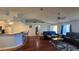 Bright living room with hardwood floors, bar seating, and seamless flow to the kitchen at 2820 Tamarind Dr, Edgewater, FL 32141