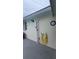 Outdoor shower area with whimsical decor, perfect for rinsing off after a swim at 2820 Tamarind Dr, Edgewater, FL 32141