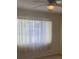Bedroom featuring a window with blinds and sheer curtains with ceiling fan at 3048 Unity Tree Dr, Edgewater, FL 32141