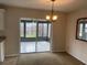 Dining room boasts sliding glass doors that lead to a screened patio at 3048 Unity Tree Dr, Edgewater, FL 32141