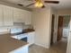 A well-lit kitchen showcases a white range and bright cabinetry at 3048 Unity Tree Dr, Edgewater, FL 32141