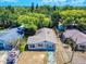A quaint one-story home featuring neutral siding, a compact front yard, and a boat parked nearby at 310 Legion Pl, Port Orange, FL 32129