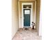 Inviting front door with decorative glass and brick walkway, enhancing curb appeal at 436 Eldora Dr, Oak Hill, FL 32759