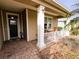 Welcoming front porch with seating area, offering a relaxing outdoor space at 436 Eldora Dr, Oak Hill, FL 32759