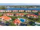 Aerial view of waterfront condos with a community pool in a beautiful coastal setting at 445 Bouchelle Dr # 301, New Smyrna Beach, FL 32169