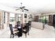 Dining room featuring a ceiling fan and large window with curtains at 445 Bouchelle Dr # 301, New Smyrna Beach, FL 32169