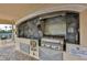 Outdoor grill with stainless steel appliances and countertop space in this community amenity at 445 Bouchelle Dr # 301, New Smyrna Beach, FL 32169