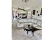 Bright living room with a comfortable couch and seamless flow into dining and kitchen areas at 445 Bouchelle Dr # 301, New Smyrna Beach, FL 32169