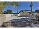 Secluded spa with surrounding privacy wall, steps, and lounge chairs at 445 Bouchelle Dr # 301, New Smyrna Beach, FL 32169