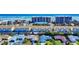 An aerial view showcases a coastal neighborhood with condos and single-Gathering homes near the beach at 4752 S Atlantic Ave # 1, Ponce Inlet, FL 32127