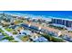 Aerial view of beachfront neighborhood with blue ocean, sandy beach, residential houses, and condominium complexes, nearby local shopping at 4752 S Atlantic Ave # 1, Ponce Inlet, FL 32127