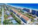 An aerial view of beachfront property along the ocean with palm trees and ample parking at 4752 S Atlantic Ave # 1, Ponce Inlet, FL 32127