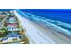 Beautiful aerial view of oceanfront properties, beach, and clear blue waters at 4752 S Atlantic Ave # 1, Ponce Inlet, FL 32127