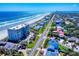 Scenic aerial view showcasing the coastline, beach, and residential properties at 4752 S Atlantic Ave # 1, Ponce Inlet, FL 32127