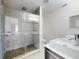 Bathroom features a glass enclosed shower and double sink vanity with white countertops at 4752 S Atlantic Ave # 1, Ponce Inlet, FL 32127