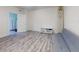 Bedroom with gray flooring, futon sofa, surfboard, and an open doorway at 4752 S Atlantic Ave # 1, Ponce Inlet, FL 32127