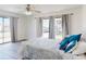 Bedroom with wood floors and a view of the beach at 4752 S Atlantic Ave # 1, Ponce Inlet, FL 32127