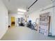 Spacious garage interior showing ample storage space and access to the home's interior, featuring room to add workshop at 4752 S Atlantic Ave # 1, Ponce Inlet, FL 32127