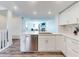 Open concept kitchen with stainless steel appliances and adjacent living area at 4752 S Atlantic Ave # 1, Ponce Inlet, FL 32127