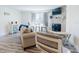 Inviting living room with a cozy fireplace, comfortable seating, and stylish decor with luxury vinyl flooring at 4752 S Atlantic Ave # 1, Ponce Inlet, FL 32127