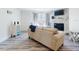 Cozy living room with stone fireplace and comfortable seating at 4752 S Atlantic Ave # 1, Ponce Inlet, FL 32127