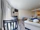 Cozy living room with a stone fireplace and a wall-mounted TV at 4752 S Atlantic Ave # 1, Ponce Inlet, FL 32127